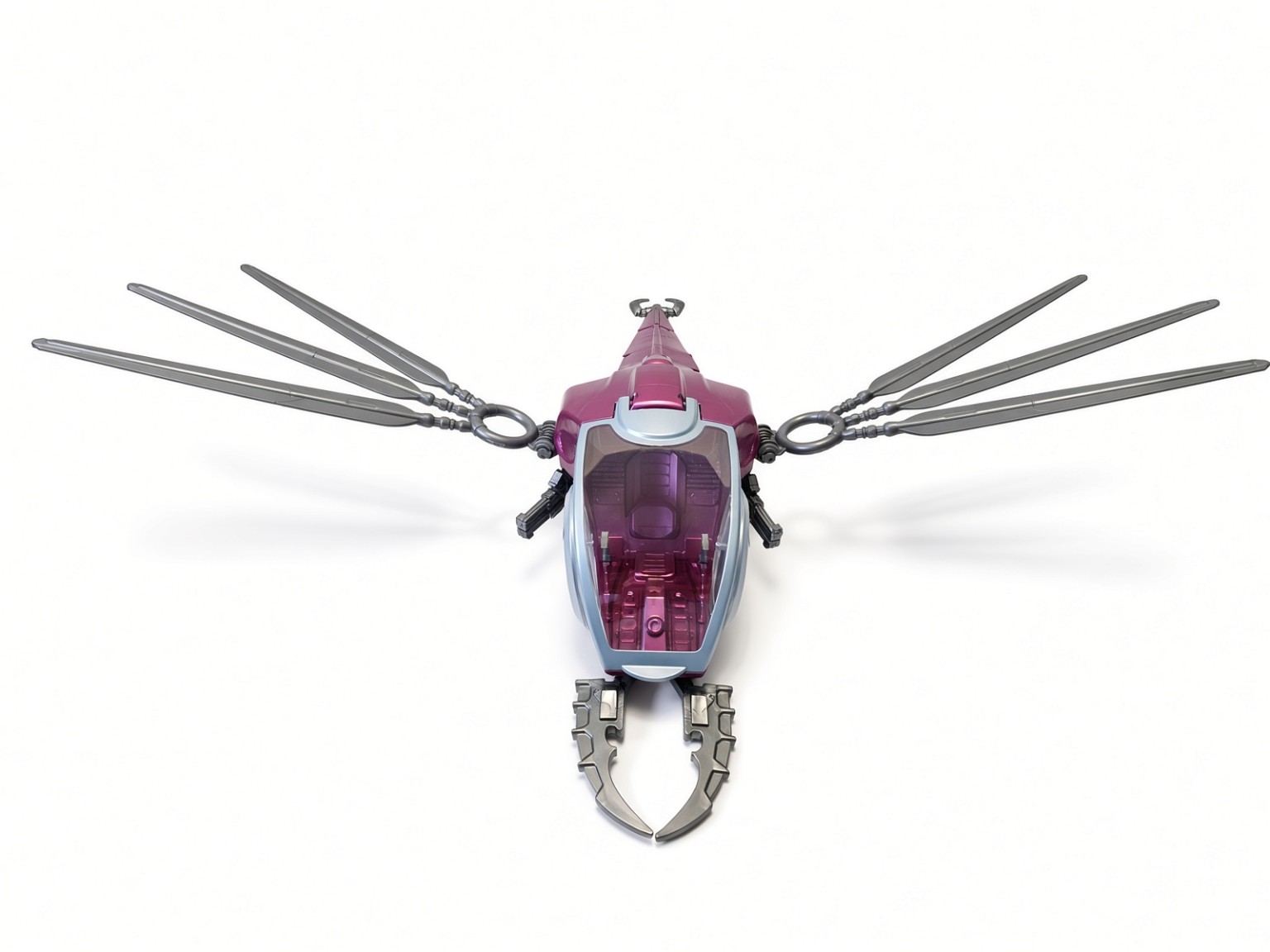 Front view of assembled purple Fright Fighter showing open front claws, cockpit canopy and wide wings.