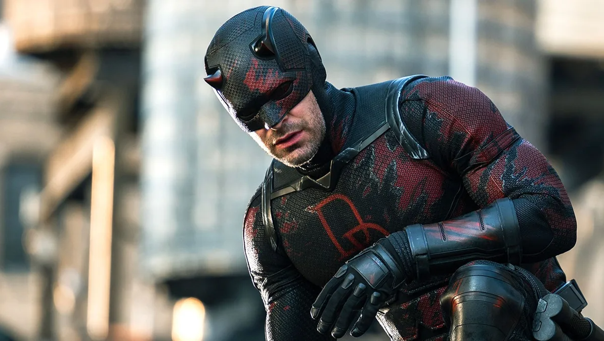 Charlie Cox as Daredevil crouches in his black-and-red suit in Daredevil: Born Again.