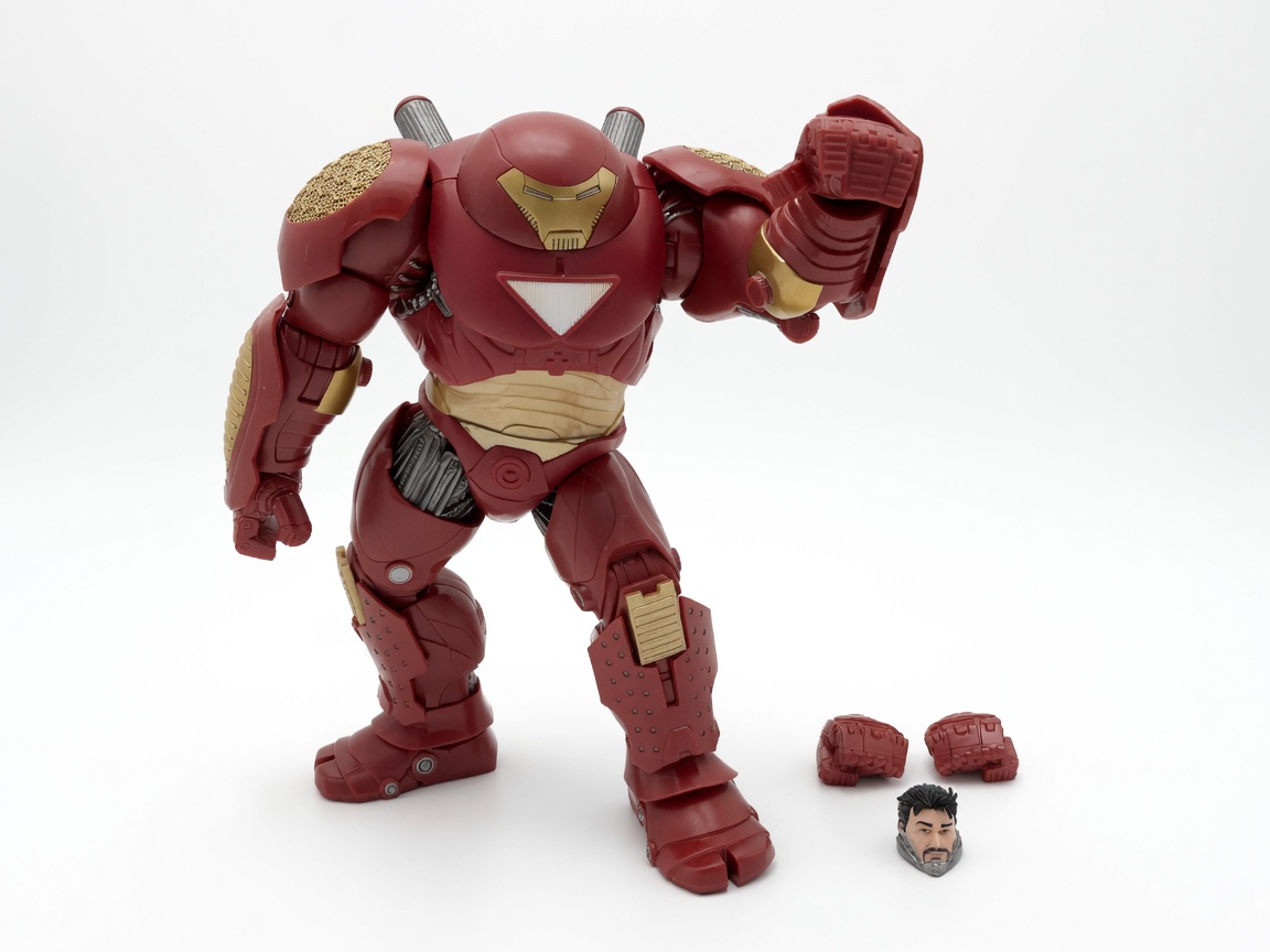 Marvel Legends Hulkbuster posed outside the box with one arm raised for a punch