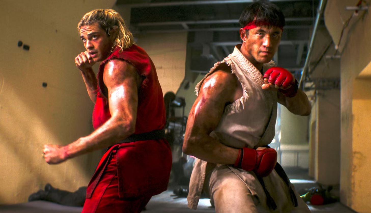 Ken Masters and Ryu stand back-to-back in fighting stances in Street Fighter