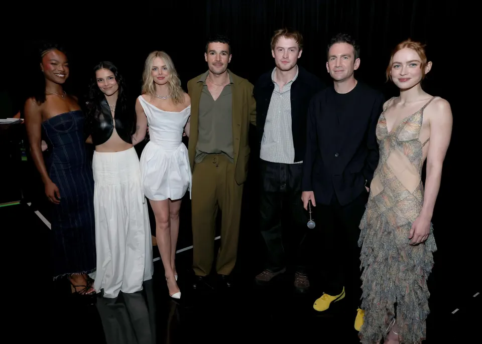 Members of the Marvel Studios X-Men cast pose beneath the X-Men logo and May 5, 2028 release date at D23.
